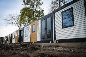 modular buildings with french doors and wooden cladding